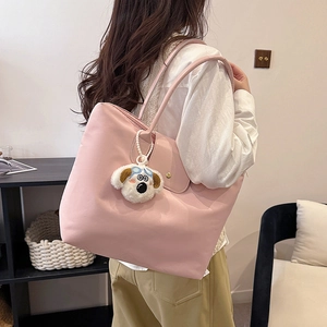 Pink large capacity nylon tote bag with cute dog plush charm for casual shoulder wear