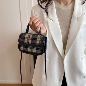 Retro houndstooth plaid wool mini handbag with black leather trim and shoulder strap