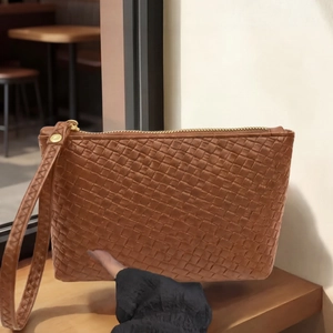 Brown woven leather handbag for men with large capacity and elegant gold zipper detail