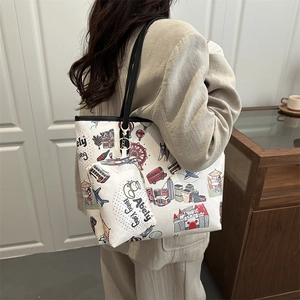 Abely Hong Kong tote bag with city illustrations and mini purse worn by a model