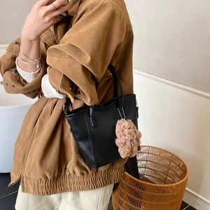 Minimalist black oil wax leather bucket bag with cute bear charm for women's casual style