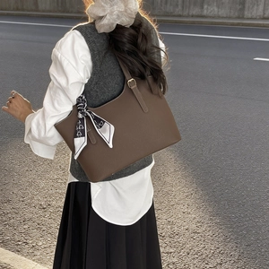 Vintage brown leather tote bag with silk scarf accessory for casual daily wear