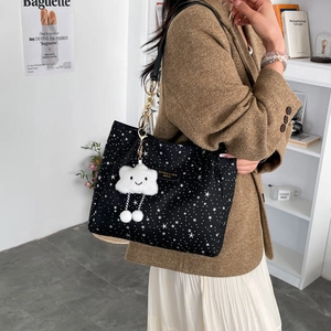 Large black tote bag with white star pattern and cloud pendant for daily commuting