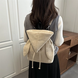 Fashionable beige faux suede backpack featuring cute rabbit ears and drawstring detail