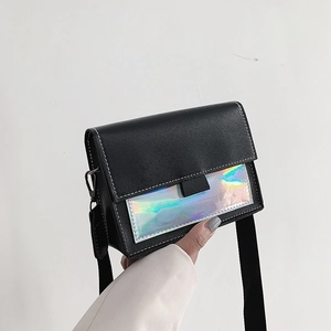 Detail of black leather handbag with iridescent panel and white contrast stitching