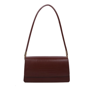 Vintage burgundy crocodile pattern handbag with elegant gold hardware and shoulder strap