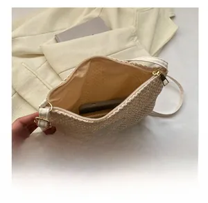 Interior view of beige woven tote bag showing large capacity for phone and wallet