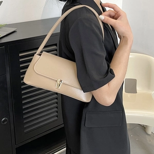 Trendy beige faux leather baguette shoulder bag with gold metal buckle for women