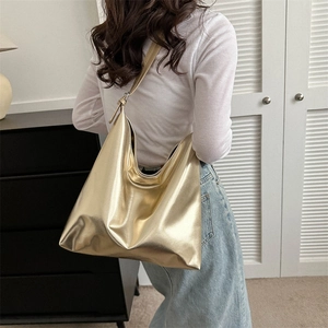 Chic gold metallic tote bag for women with spacious interior and wide shoulder strap