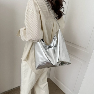 Minimalist large silver mirror tote bag for women showing glossy metallic shoulder style