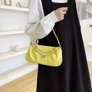 Fashionable bright yellow pleated underarm bag for women with silver heart chain accessory