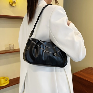 Fashionable black pleated underarm bag with silver chains and heart pendant decoration