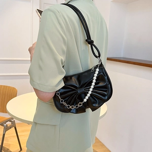 Fashionable black shoulder bag with bow detail and pearl flower decorative chain