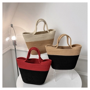 Close-up of woven tote bags showing high-quality bicolor paper rope texture and sturdy handles