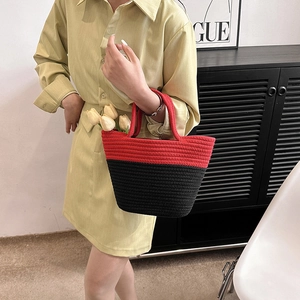 Fashionable red and black woven bucket bag with horizontal spiral texture and top handle