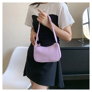 Detail shot of a lilac hobo shoulder bag with crescent shape and smooth zipper