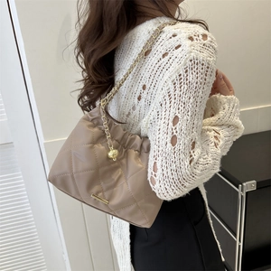 Elegant khaki quilted tote bag with golden chain strap and metallic ball pendant