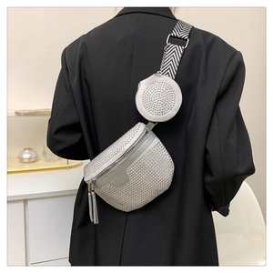 Detail of silver rhinestone saddle bag with wide strap and matching mini round coin purse