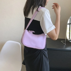 Minimalist purple faux leather baguette shoulder bag for women in lifestyle setting