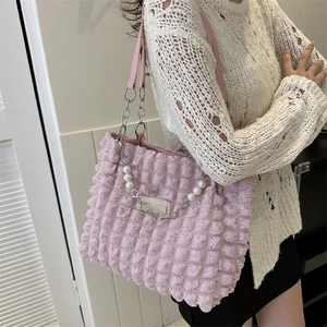 Pink bubble texture tote bag with pearl chain strap and minimalist crossbody style