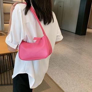 Minimalist bright pink PU leather shoulder bag for women featuring a sleek underarm design
