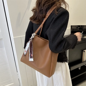 Brown large capacity tote bag with woven shoulder strap and decorative silk scarf