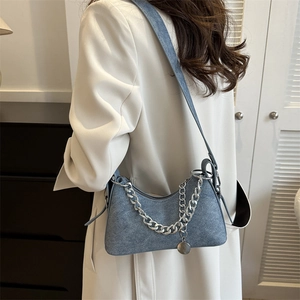Blue denim underarm bag with silver thick chain and round metal pendant for women