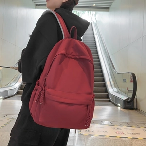 Dunkelroter minimalistischer Damenrucksack mit stilvollem gewebtem Reißverschluss-Detail
