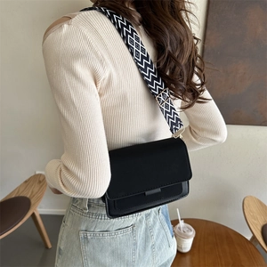 Minimalist black square crossbody bag with stylish geometric pattern wide strap for women