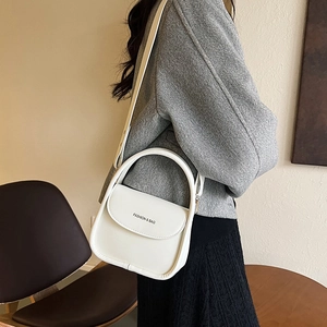Elegant white matte leather crossbody handbag with curved handle and FASHION & BAG print