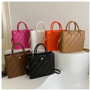 Multi-color collection of quilted square handbags featuring a gold flower metal detail