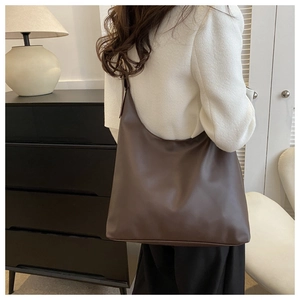 Deep brown leather Hobo shoulder bag with large capacity shown in a home interior setting