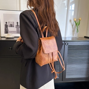 Women's vintage caramel faux leather backpack with drawstring and flap closure