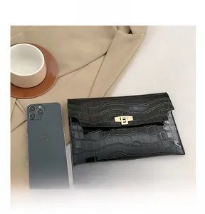 Glossy black crocodile pattern envelope clutch size comparison with iPhone and coffee
