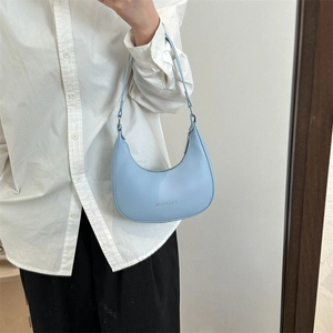 Light blue faux leather half-moon shoulder bag with Fashion lettering print