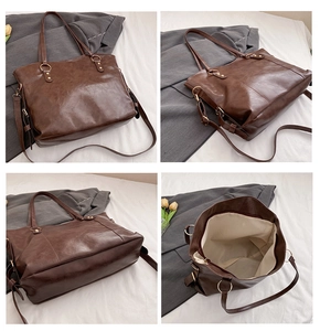 Macro details of large brown PU leather tote bag showing texture and golden hardware