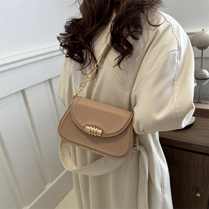 Beige minimalist crossbody bag with gold hardware and chain strap for women