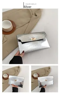 Silver envelope clutch bag with crocodile texture and golden metal twist lock detail