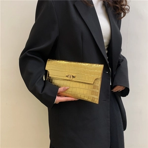 Minimalist gold metallic crocodile texture envelope clutch bag with golden turn-lock closure