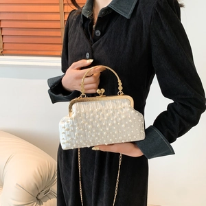 Elegant off-white pearl embellished shell bag with gold handle and chain shoulder strap