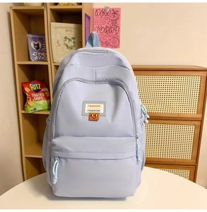 Detail of lavender large capacity casual backpack with dual zippers and side pockets