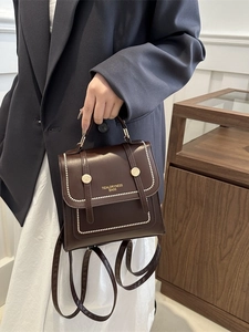 Retro dark brown PU leather backpack with white stud rivets and top handle for travel