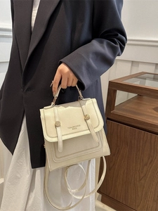 Creamy white waterproof backpack with minimalist leather texture and gold buckle