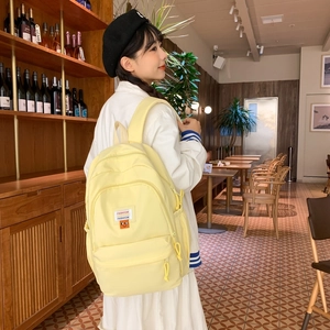 Yellow minimalist large capacity student backpack with cute smile embroidery