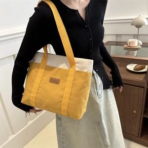 Fashion canvas tote bag in yellow and white patchwork with wide shoulder strap