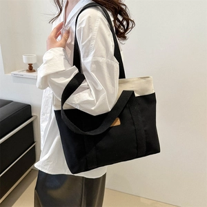 Minimalist bicolor canvas tote bag for women with large capacity and broad shoulder straps