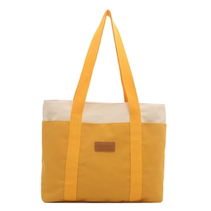 Large capacity canvas tote bag in yellow and beige patchwork with a leather fashion tag