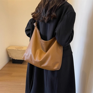 Minimalist large brown hobo tote bag for women made of premium pebble leather for daily commute