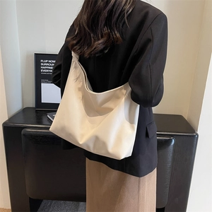 Minimalist cream beige large tote bag in lychee texture leather for stylish daily commute