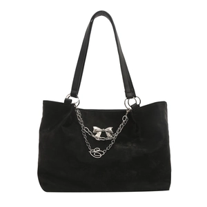 Fashionable black suede tote bag with silver chain pendants and bow detail for women